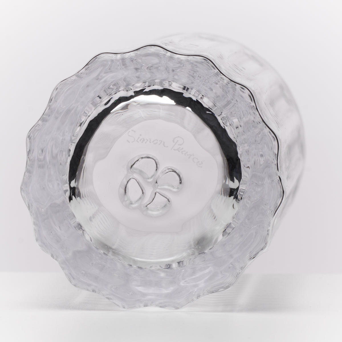 Two clear Collins glasses with scalloped rims and etched decorative pattern shown from above.