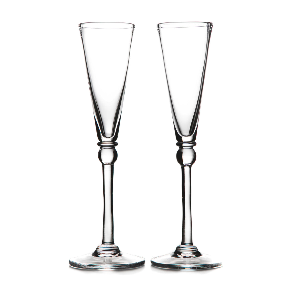 Two clear glass champagne flutes with tapered bowls and decorative stem bases.