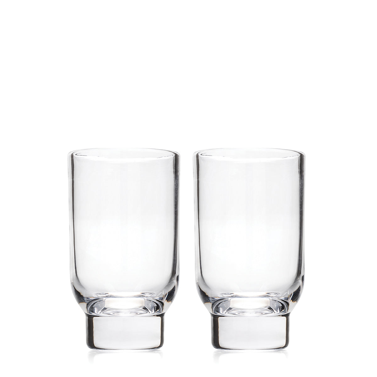 Two clear glass tumblers with thick bases displayed side by side.