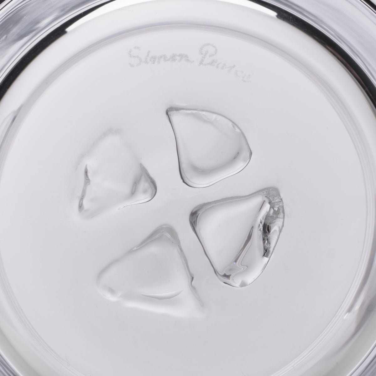 White ice bucket with four ice cubes inside and "Simon Pearce" text on the lid.