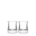 Two clear glass whiskey glasses with curved sides and weighted bases, each partially filled with clear liquid.
