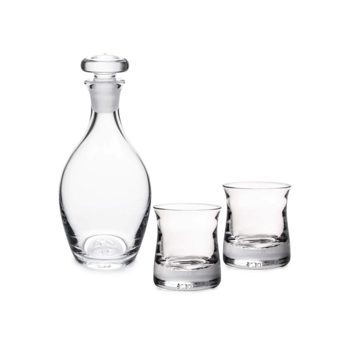 Glass decanter with stopper and two matching whiskey glasses.