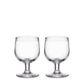 Two clear glass goblets with pedestal bases and rounded bowls.