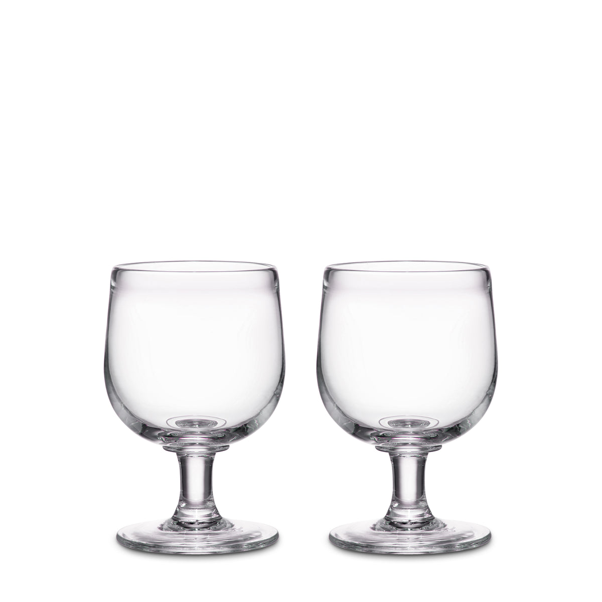Two clear glass goblets with pedestal bases and rounded bowls.