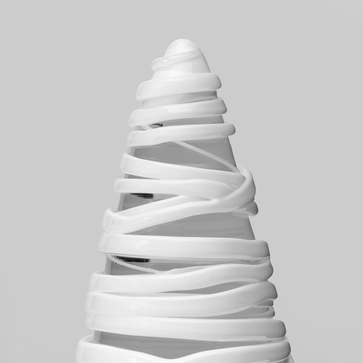 White conical tree with spiral wrapping design, 8 inches tall.