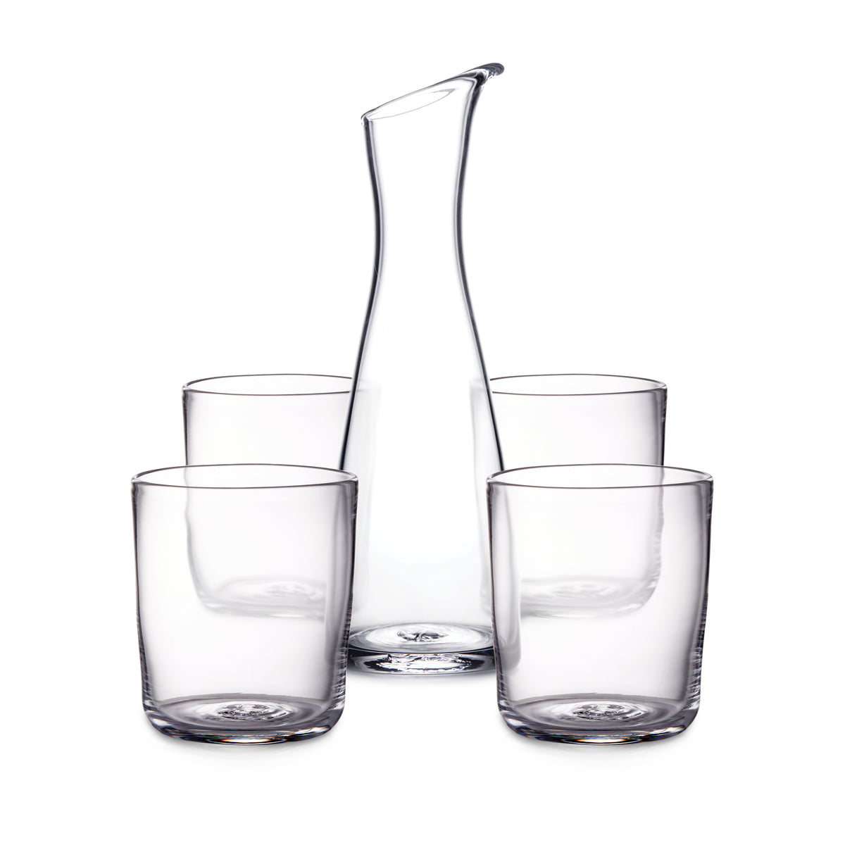 Clear glass carafe with curved pouring spout surrounded by four matching drinking glasses.