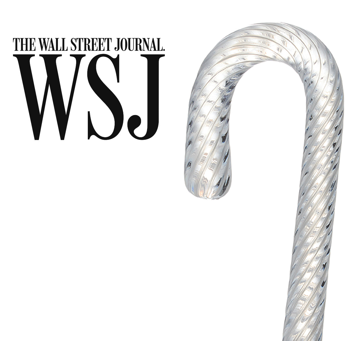 The Wall Street Journal feature: Simon Pearce handblown glass candy cane ornament with a twisted ribbed texture on a white background
