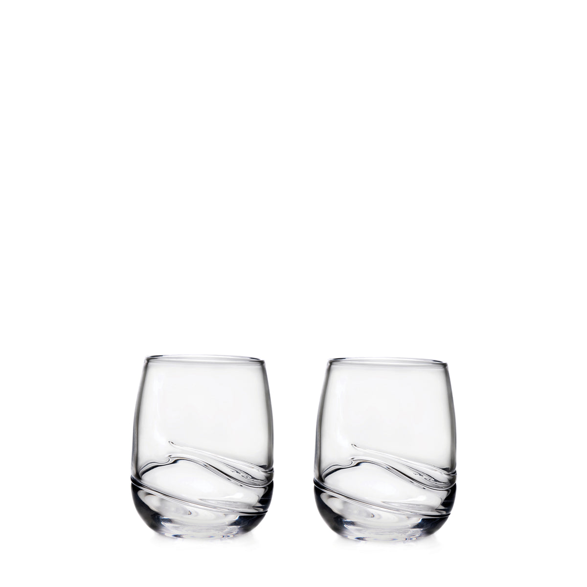 Two clear glass tumblers with curved swirl design at the base.