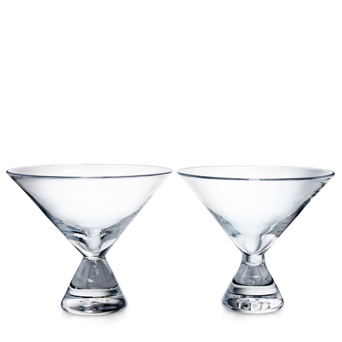 Two clear glass stemless martini glasses with wide bowls and weighted bases.