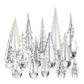 Clear glass and frosted tree figurines in varying heights arranged in a forest-like formation.