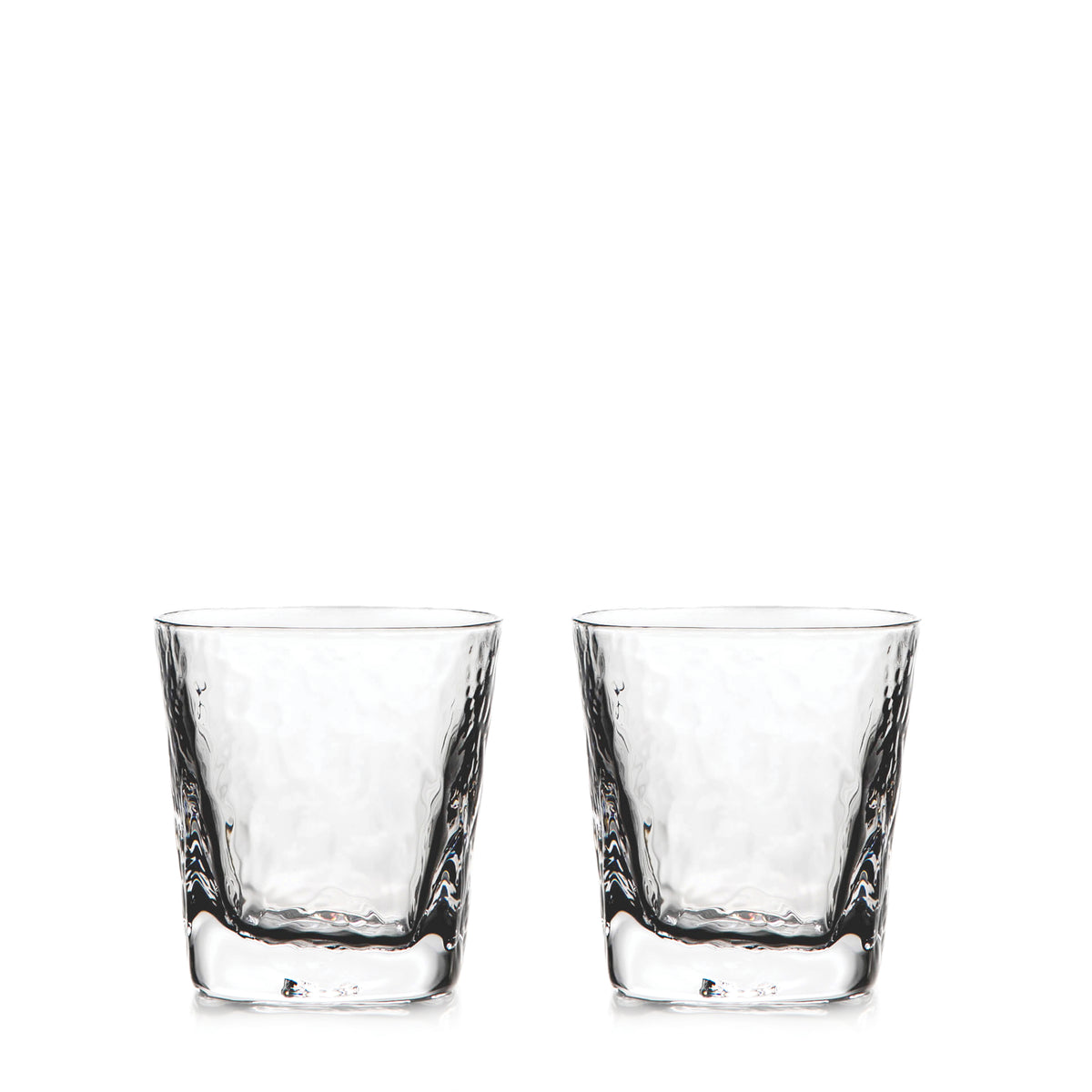 Two clear double old-fashioned glasses with textured sides and thick bases.