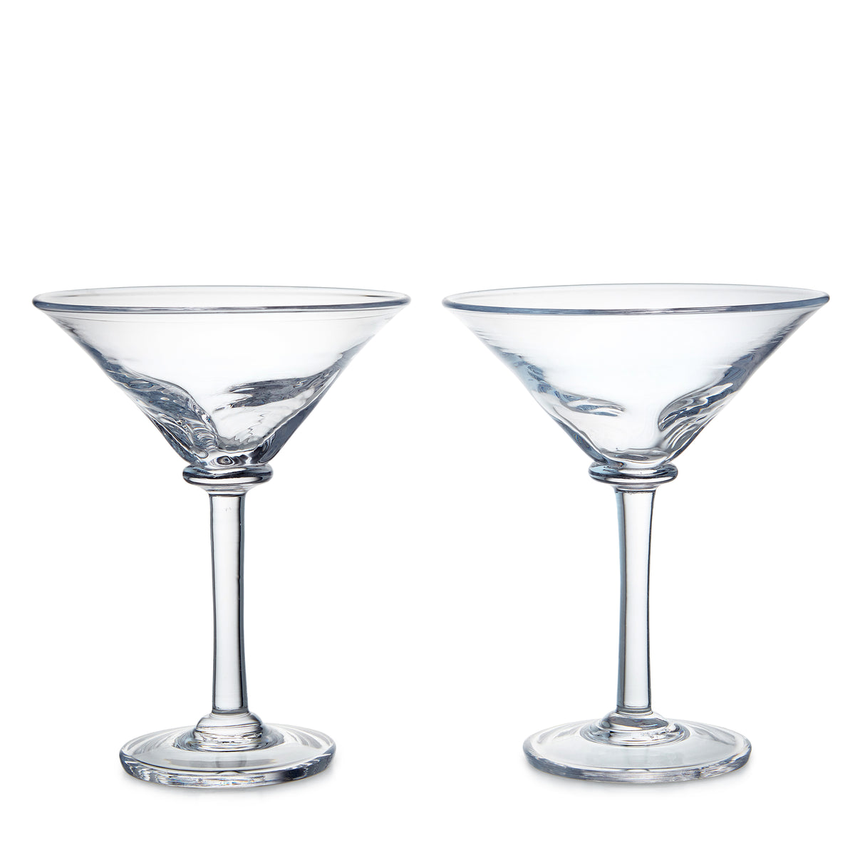 Two clear glass martini glasses with wide bowl-shaped tops and stem bases.