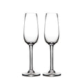 Two clear glass champagne flutes with tapered bowls and stem bases.