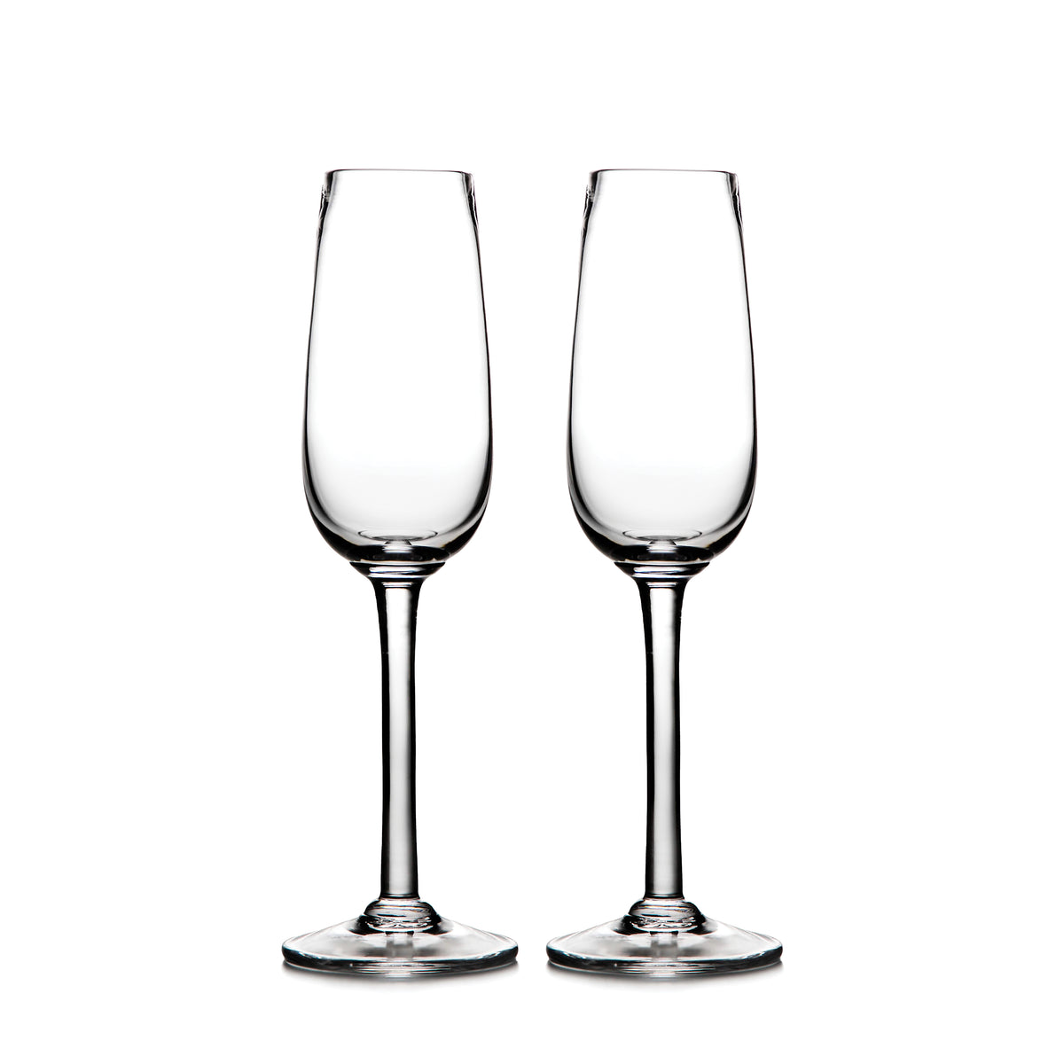 Two clear glass champagne flutes with tapered bowls and stem bases.