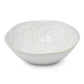 White ceramic pasta bowl with embossed sand dollar pattern and beige rim detail.