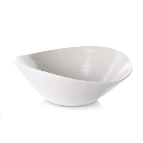 White ceramic pasta bowl with asymmetrical curved sides and tapered bottom.