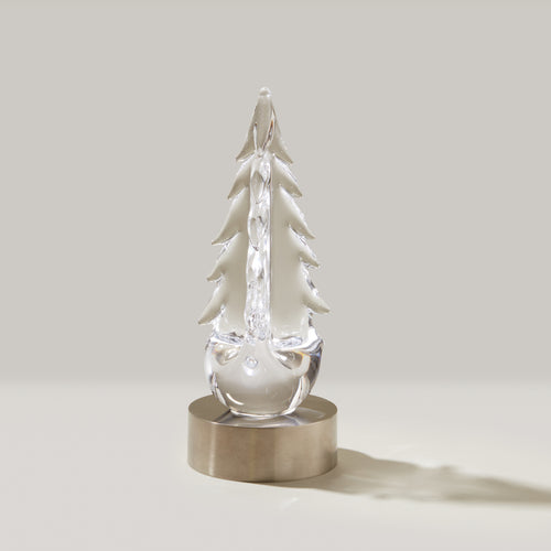 Clear glass tree-shaped figurine with frosted branches on a brushed metal circular base.