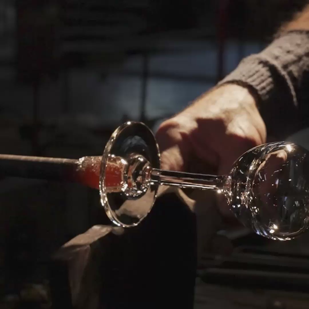 A glassblower making a wine glass