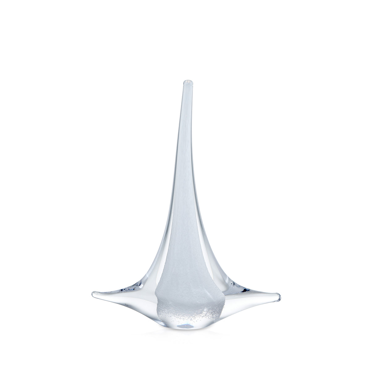 Clear glass sailboat figurine with tall mast and curved sail-like base on white background.