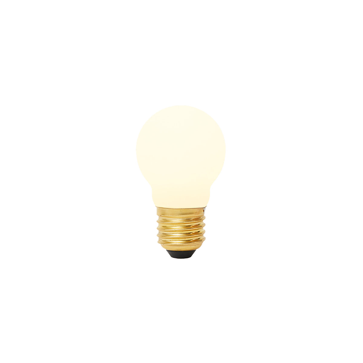 Matte porcelain spherical LED bulb with brass threaded base and black contact point, glowing warm white.