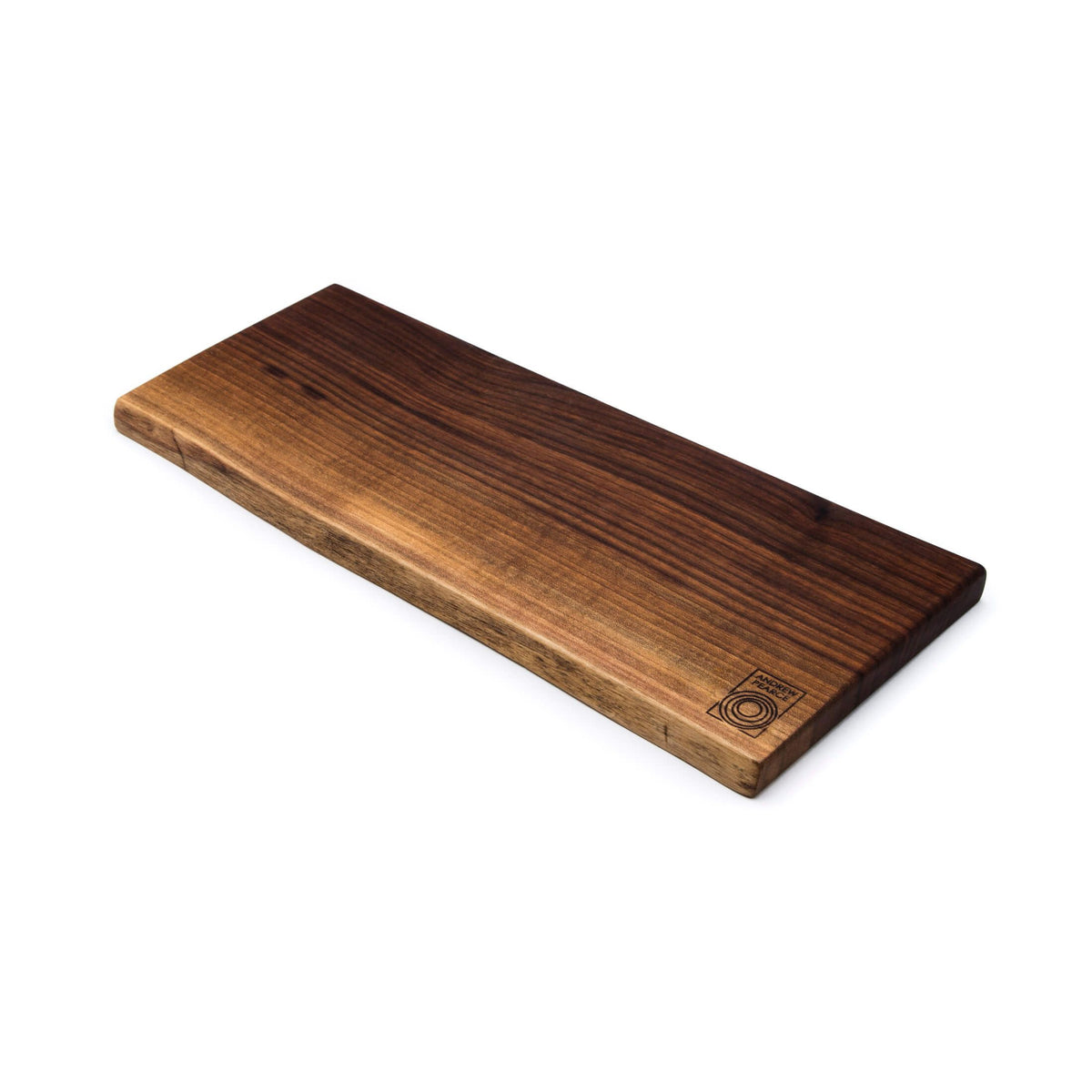 Dark brown walnut board with natural live edge and small circular logo on bottom corner.